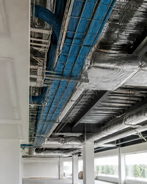 Data cable in overhead trays during an office buildout